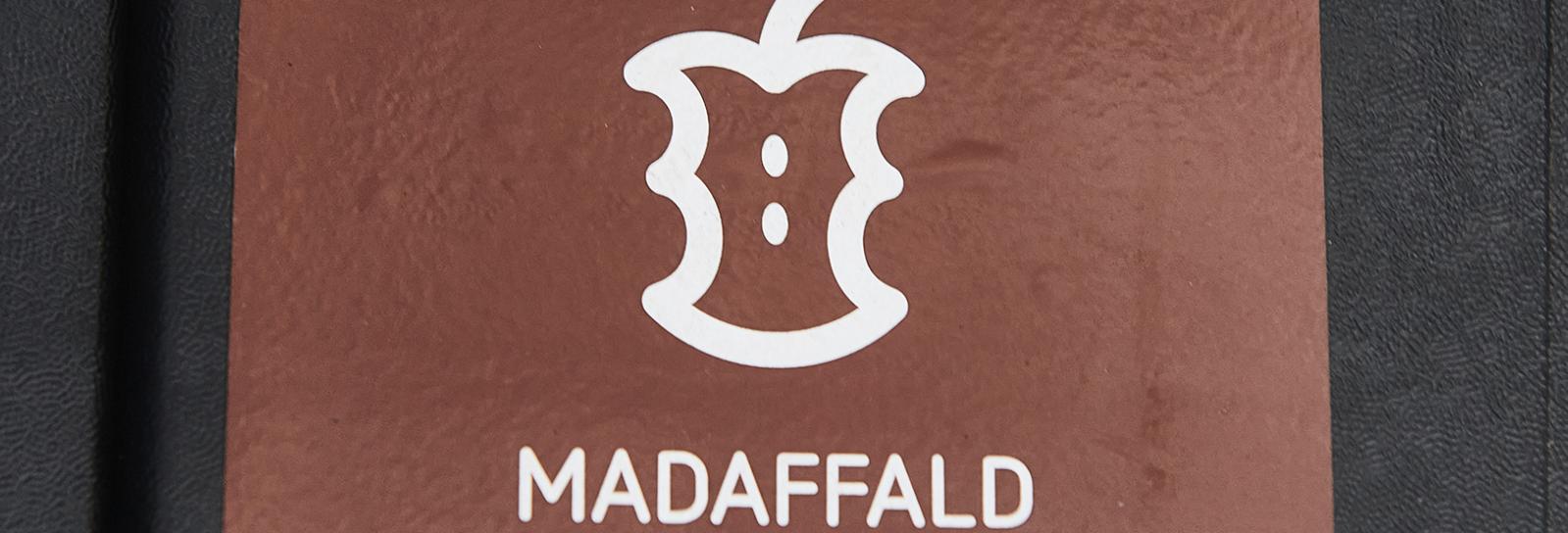 Grafisk repræsentation af et æbleskrog med teksten ''madaffald''